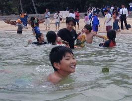 Swimming season starts at Okinawa beach